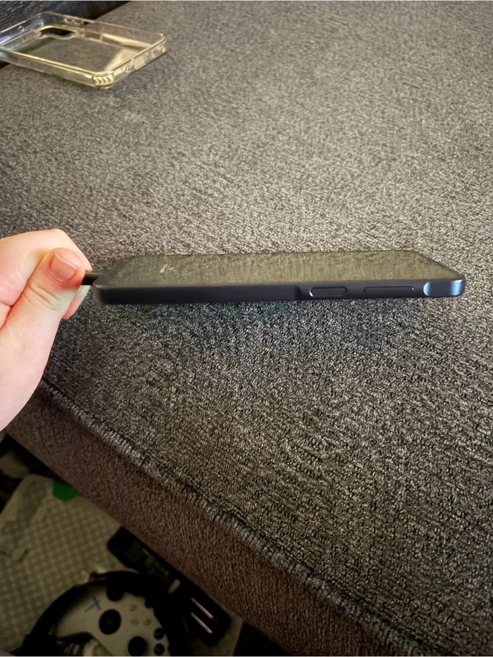 Samsung Smartphone in Black with Blue-Green Wallpaper